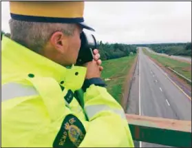  ?? DARRELL COLE – AMHERST NEWS ?? Const. Bryce Haight of the RCMP’S Northern Traffic Services holds up a LIDAR device police use to measure speed.