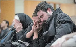  ?? DARRYL DYCK THE ASSOCIATED PRESS FILE PHOTO ?? Babak Razzaghi and his sister Banafsheh Razzaghi mourn the loss of their sister Niloofar Razzaghi, brother-in-law Ardalan Hamidi and nephew Kamyar Hamidi, who died in a Ukraine airplane crash last January.