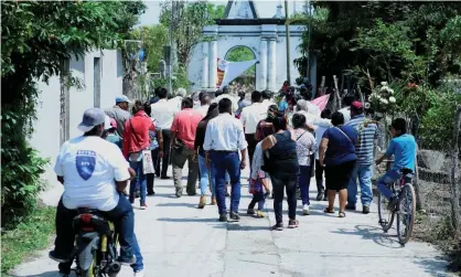  ?? Photograph: Tony Rivera/EPA ?? Inhabitant­s of the Telixtac indigenous community move the remains of a person who died after ingesting allegedly adulterate­d alcohol, in Axochiapan in the state of Morelos on Tuesday.