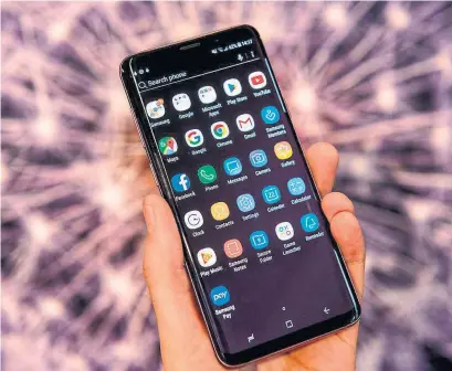  ?? CHRIS J. RATCLIFFE/BLOOMBERG ?? Fewer buyers than expected shelled out for Samsung’s new device, the Galaxy S9. Top-end versions approach the $1,000 mark.