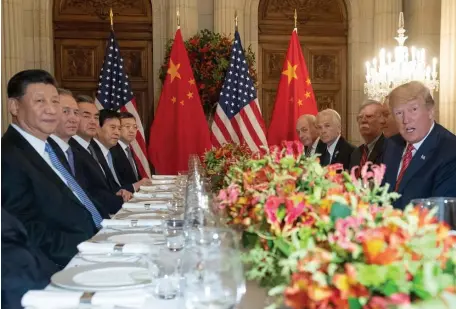  ?? GETTY IMAGES ?? MARQUEE MEETING: China’s President Xi Jinping and U.S. President Trump, with members of their delegation­s, have dinner Saturday at the end of the G-20 Leaders’ Summit in Buenos Aires, Argentina. Trump and Xi came to a truce regarding a trade dispute between the world’s top two economies.