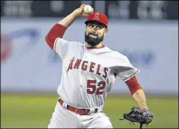  ?? BEN MARGOT / AP ?? Pitcher Matt Shoemaker wore a carbon-fiber protective insert under his hat Tuesday to protect an area where a titanium plate was inserted on his skull.