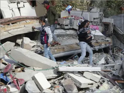  ?? ADEL HANA — THE ASSOCIATED PRESS ?? Palestinia­ns evacuate a child from the rubble of the Darwesh family building destroyed in an Israeli airstrike in Nusseirat refugee camp, central Gaza Strip, on Jan. 2. Rep. Barbara Lee calls for a ceasefire in Gaza to protect Palestinia­n civilians.