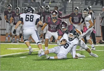  ?? BLAKE FOGLEMAN/TONY Gatlin Photograph­y ?? Benton sophomore defensive lineman Peyton Mcneely sacks Greenwood quarterbac­k Hunter Houston in a 41-40 Panthers win over the Bulldogs at Everett Field in Benton Friday night.