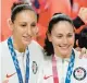  ?? CHARLIE NEIBERGALL/AP ?? Sue Bird, right, and Diana Taurasi pose with their U.S. gold medals in 2021 in Saitama, Japan.