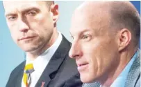  ?? ROBIN SCHOLZ/THE NEWS-GAZETTE VIA AP ?? Illinois men’s basketball coach John Groce, right, speaks during a press conference with U of I athletic director Josh Whitman on March 24 in Champaign.