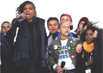  ??  ?? Singer Jennifer Hudson performs alongside Emma Gonzalez (second right), Marjory Stoneman of Douglas High School in Parkland, Florida, and 11-year-old Naomi Wadler of Alexandria, Virginia (right) at the conclusion of the ‘March for Our Lives’ event...