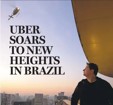  ?? ANDRE PENNER/ASSOCIATED PRESS PHOTOS ?? A passenger waits for a helicopter that was booked Tuesday with the applicatio­n Uber, at a hotel in Sao Paulo, Brazi. The ride-booking company Uber has begun providing helicopter rides in Brazil biggest city.