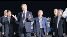 ??  ?? US President Donald Trump speaks at a ceremony held to welcome back Tony Kim (second left), Kim Dong-chul (centre right) and Kim Hak-song (right), who were detained in North Korea for more than a year, at Andrews Air Force Base in Maryland on May 10.