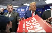  ?? ANDREW HARNIK — THE ASSOCIATED PRESS ?? Former President Donald Trump signs autographs after speaking at a rally at Des Moines Area Community College in Newton, Iowa, Saturday.