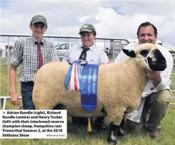  ?? Athwenna Irons ?? Adrian Rundle (right), Richard Rundle (centre) and Henry Tucker (left) with their interbreed reserve champion sheep, Hampshire ram Treworthal Seamus 2, at the 2018 Stithians Show