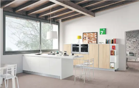  ?? I MAG E S C O U RT E S Y O F F E L L I N I D E S I G NS ?? Even the smallest of kitchens can work in a space that features a large window and vaulted ceiling.