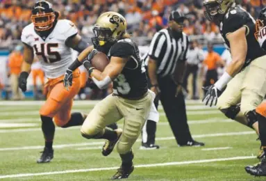  ??  ?? Colorado tailback Phillip Lindsay finds running room against Oklahoma State during the Alamo Bowl in San Antonio on Thursday. CU wrapped up a 10-4 season with a 38-8 loss to the Cowboys. Andy Cross, The Denver Post