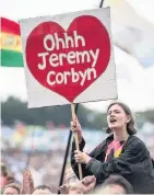  ??  ?? Signs in support of Jeremy Corbyn in the Glastonbur­y crowd