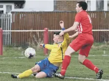  ??  ?? RCA’s Reece Noble (yellow) moves in to deny Ryhope CW’s James Ellis.