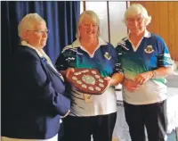  ??  ?? Anne MacDougall and Janet Campbell receive the pairs shield.
