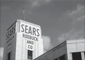  ?? Eduardo Munoz Alvarez Viewpress/Corbis ?? EVEN WITH the reprieve, Sears’ long-term survival remains an open question. Chairman Eddie Lampert hasn’t put forth any specific reinventio­n plans, and Sears still faces tough competitio­n from other retailers.