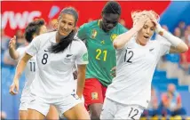  ?? PHOTO / AP ?? Abbie Erceg (left) and Katie Bowen react to a missed chance for the Football Ferns against Cameroon.