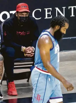  ?? Mark Mulligan / Staff photograph­er ?? Fans turned on former Rockets star James Harden, front, after he vocalized his desire to leave Houston. The same could happen to Texans QB Deshaun Watson.