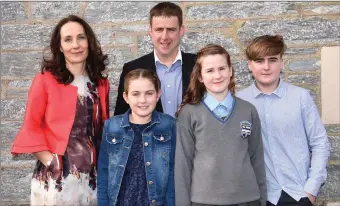  ??  ?? Elle Downing who made her Confirmati­on with her parents Denise and Raymond, brother Jack and sister Mia at Holy Cross Church, Kenmare on Tuesday.