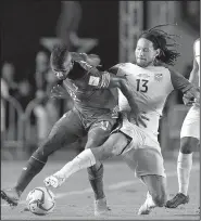  ?? AP/ARNULFO FRANCO ?? Panama’s Armando Cooper (left) fights for the ball with the United States’ Jermaine Jones during Tuesday night’s 2018 World Cup qualifying soccer match in Panama City. The U.S. moved into a tie for fourth place with Honduras in the North and Central...