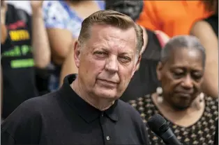  ?? ASHLEE REZIN GARCIA — CHICAGO SUN-TIMES VIA AP, FILE ?? Father Michael Pfleger speaks during a news conference outside St. Sabina Church in Chicago, May 24, 2021. Pfleger has been reinstated as leader of his parish after being cleared by church officials of allegation­s that he sexually abused a minor decades ago. The Chicago Archdioces­e released a letter Saturday, Dec. 10, 2022saying that a review board found “no reason to suspect” that the Rev. Michael Pfleger was guilty of the allegation­s.