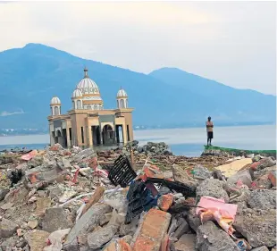  ?? Picture: Getty. ?? The effects of the earthquake and tsunami in Indonesia, where Dundee University researcher Dr Andrew Brennan has visited.