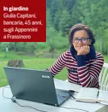  ??  ?? In giardino Giulia Capitani, bancaria, 45 anni, sugli Appennini a Frassinoro