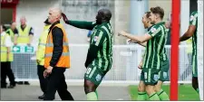  ??  ?? DANCE OFF: Adebayo Akinfenwa of AFC Wimbledon celebrates his equaliser