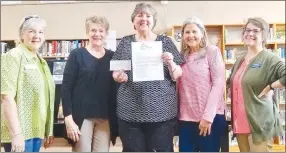  ?? Submitted Photo ?? Karen Benson (center), director of the Gravette Public Library, displays the $500 check and an award letter for the $4,000 grant given by the Bentonvill­e/Bella Vista Chapter of Altrusa Internatio­nal in support of the library’s summer reading program. The Altrusa chapter has been supporting the library with donations for the last several years. Pictured with Benson are Altrusa members Gay Kiker, Gail Cowdin and Karen McAuley, and library clerk Brittany Mangold. Registrati­on for the children’s summer reading program begins Thursday, June 16.