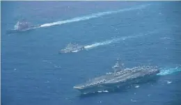  ??  ?? (Top Left and Right) US Navy’s only forward-deployed aircraft carrier, USS Ronald Reagan (CVN 76), USS Shiloh (CG 67) and USS Halsey (DDG 97) steam in formation with Indian Navy Talwar-class frigate INS Teg (F 45) and Kolkata-class stealth guided-missile destroyer INS Kochi (D 64); (Above Left) USS Ronald Reagan and USS Shiloh in formation with Indian Navy Talwar-class frigate INS Teg; (Above Right) USS Ronald Reagan, USS Shiloh and USS Halsey in formation with INS Teg and INS Kochi.