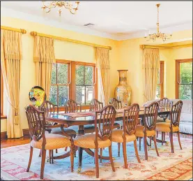  ??  ?? The formal dining room is spacious and elegant.
