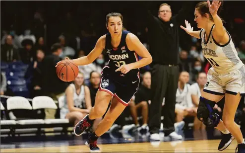  ?? AJ Mast / Associated Press ?? UConn guard Caroline Ducharme, left, in action against Butler on Jan. 12 in Indianapol­is.