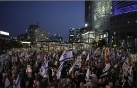  ?? LEO CORREA — THE ASSOCIATED PRESS ?? People protest in Tel Aviv on Saturday against Israeli Prime Minister Benjamin Netanyahu's government and call for the release of hostages held by Hamas.