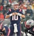  ?? Steven Senne / Associated Press ?? Patriots quarterbac­k Mac Jones (10) signals from the line during the first half against the Buccaneers on Sunday in Foxborough, Mass.