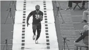  ?? DAVID J. PHILLIP/AP ?? Memphis defensive back Arthur Maulet runs the 40-yard dash at the NFL scouting combine on Monday in Indianapol­is.