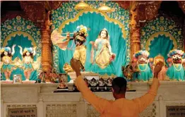  ?? — PTI ?? A devotee offers prayers at a Iskcon temple after it re-opened during Unlock 2.0 in Noida on Thursday.