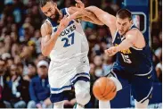  ?? David Zalubowski/Associated Press ?? Nikola Jokic, right, and the Nuggets will begin their title defense on Saturday against the L.A. Lakers.