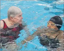  ?? [TOM DODGE / DISPATCH] ?? Instructor Pam Jackson, left, working with Donna Broadnax to improve Broadnax’s swimming