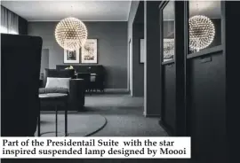  ??  ?? Part of the Presidenta­il Suite with the star inspired suspended lamp designed by Moooi