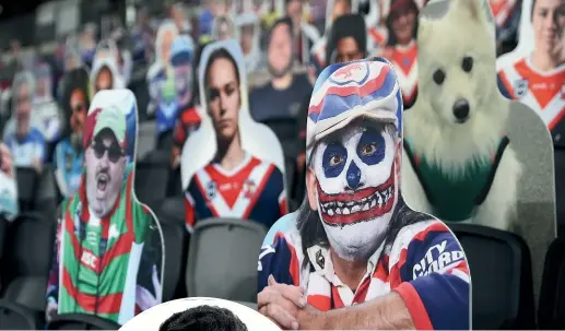  ?? GETTY ?? Cardboard cutouts of fans occupied the seats as the Roosters defeated the Rabbitohs 28-12 when the competitio­n restarted last week.
