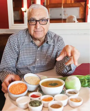  ??  ?? Vijay Thurkal, keeps the ingredient­s in the mulligataw­ny soup he serves at his namesake restaurant Vijay’s close to his chest. He says it’s his secret garam masala blend of spices that makes the difference.