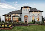  ??  ?? The Juniper model home is in Cinco Ranch in The Enclave at Ridgefield Heights.