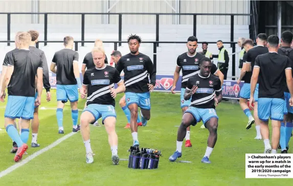 ?? Antony Thompson/TWM ?? Cheltenham’s players warm up for a match in the early months of the
2019/2020 campaign