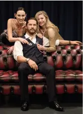  ?? — AP ?? Models Emily Denton and Eli Anguelova pose with the new wax figure of actor Tom Hardy after its unveiling at Madame Tussauds in London on Thursday.