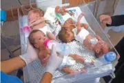  ?? AP PHOTO/FATIMA SHBAIR ?? Medics prepare premature babies for transport to Egypt Nov. 20 after they were evacuated from Shifa Hospital in Gaza City to a hospital in Rafah, Gaza Strip.