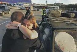  ?? Carolyn Cole Los Angeles Times ?? ANNA STRISHKO hugs her father, Vitalin, in Zaporizhzh­ia. The two, from Vasylivka, Ukraine, had been separated since the beginning of the war.