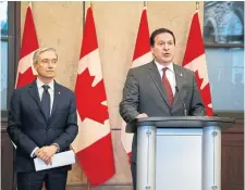  ?? DAVID KAWAI THE CANADIAN PRESS ?? Public Safety Minister Marco Mendicino, right, seen with Innovation Minister François-Philippe Champagne, said he intends to introduce a new law that will focus on protecting “cyber and telecommun­ications where many essential sectors operate.”