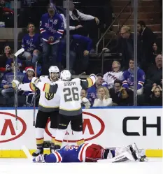  ?? BRUCE BENNETT/GETTY IMAGES ?? Golden Knights’ Alex Tuch celebrates his game-winning goal against the Rangers with teammate Paul Stastny.