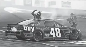  ?? AMBER SEARLS/USA TODAY SPORTS ?? Cup Series driver Alex Bowman celebrates Sunday after winning the Toyota Owners 400 at Richmond Internatio­nal Raceway.